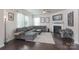 Cozy living room with a fireplace, ample seating, natural light, and stylish decor at 16803 Cozy Cove Rd, Charlotte, NC 28278
