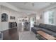 Open concept living room and kitchen with hardwood floors and modern furnishings at 16803 Cozy Cove Rd, Charlotte, NC 28278