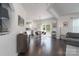 Open-concept living space with hardwood floors, abundant natural light, and seamless flow to the kitchen at 16803 Cozy Cove Rd, Charlotte, NC 28278