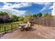 Enjoy outdoor dining on this spacious wooden deck with seating and a grill at 17309 Knoxwood Dr, Huntersville, NC 28078