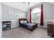 ' bedroom with a vaulted ceiling, large window, and playful decor at 17309 Knoxwood Dr, Huntersville, NC 28078