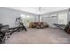 Large bonus room with carpet, gray walls, seating, large windows, and exercise equipment at 17309 Knoxwood Dr, Huntersville, NC 28078