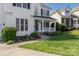 Close up of the front porch with a welcoming entrance and manicured landscaping at 17309 Knoxwood Dr, Huntersville, NC 28078