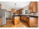 Stylish kitchen with stainless steel appliances, granite counters, and central island at 17309 Knoxwood Dr, Huntersville, NC 28078