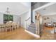 Open-concept living space with staircase and dining area at 17309 Knoxwood Dr, Huntersville, NC 28078