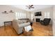 Cozy living room features hardwood floors, fireplace, and comfortable seating at 17309 Knoxwood Dr, Huntersville, NC 28078