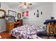 This cozy bedroom has hardwood floors, ceiling fan, and decor on the wall at 175 Neita Dr, Salisbury, NC 28147