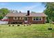 Charming one-story brick home featuring a well-maintained front yard and a cozy, inviting facade at 175 Neita Dr, Salisbury, NC 28147