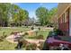 Inviting brick home with a curved walkway, bird bath, and lush greenery in a well-kept front yard at 175 Neita Dr, Salisbury, NC 28147