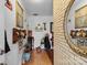 Inviting hallway featuring hardwood floors, white brick accent wall and stylish decor creating a warm and welcoming atmosphere at 175 Neita Dr, Salisbury, NC 28147