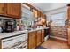 A well-lit kitchen featuring vintage cabinets, laminate countertop and decorative backsplash at 175 Neita Dr, Salisbury, NC 28147