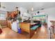 Eat-in kitchen with retro charm features booth seating and a view into the living room at 175 Neita Dr, Salisbury, NC 28147