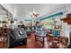 Spacious living room featuring large windows, comfortable sofas, and a ceiling fan at 175 Neita Dr, Salisbury, NC 28147