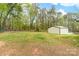 A wide shot of the backyard with a view of the detached garage at 1957 Beth Haven Church Rd, Denver, NC 28037