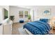 Bedroom with a blue-patterned bed and decor, side tables, and natural light from the windows at 1957 Beth Haven Church Rd, Denver, NC 28037