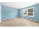 Cozy bedroom with natural light, carpeted floors and large windows at 1957 Beth Haven Church Rd, Denver, NC 28037