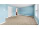 Bright bedroom featuring blue walls, neutral carpet, and natural light from the windows at 1957 Beth Haven Church Rd, Denver, NC 28037