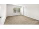 Spacious carpeted bedroom with a window for natural light at 1957 Beth Haven Church Rd, Denver, NC 28037