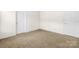 Carpeted bedroom with two doors at 1957 Beth Haven Church Rd, Denver, NC 28037
