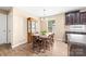 Bright dining area with wood table, chairs, hutch, and view to yard at 1957 Beth Haven Church Rd, Denver, NC 28037