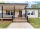 Welcoming front entrance with a charming porch and manicured landscaping at 1957 Beth Haven Church Rd, Denver, NC 28037