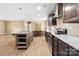 Modern kitchen featuring stainless steel appliances, wooden floors, and an island with breakfast bar at 1957 Beth Haven Church Rd, Denver, NC 28037
