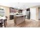 Beautiful kitchen featuring an island, stainless steel refrigerator, and an adjacent dining area at 1957 Beth Haven Church Rd, Denver, NC 28037