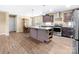 Spacious kitchen with a center island, stainless steel appliances, and hardwood floors at 1957 Beth Haven Church Rd, Denver, NC 28037