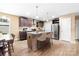 Modern kitchen with an island, stainless steel appliances, and ample cabinet space at 1957 Beth Haven Church Rd, Denver, NC 28037