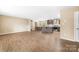 Open-concept living space with wood floors connecting living, dining, and kitchen at 1957 Beth Haven Church Rd, Denver, NC 28037