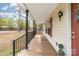 Spacious front porch with black railings, offering a relaxing outdoor space at 1957 Beth Haven Church Rd, Denver, NC 28037