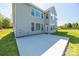 Back exterior showcasing a large patio and an expansive backyard, perfect for outdoor living at 2004 Ptarmigan Ct, Waxhaw, NC 28173