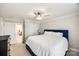 Inviting bedroom with a soft bed, neutral walls, and a view to another room, perfect for relaxation at 2004 Ptarmigan Ct, Waxhaw, NC 28173