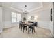 Bright dining room featuring neutral walls, modern lighting, and ample natural light creating an inviting atmosphere at 2004 Ptarmigan Ct, Waxhaw, NC 28173