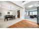 Elegant dining area featuring hardwood floors, a sophisticated chandelier, and seamless transition to adjacent living spaces at 2004 Ptarmigan Ct, Waxhaw, NC 28173
