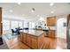 Well-lit kitchen with stainless steel appliances and an island with barstool seating at 2004 Ptarmigan Ct, Waxhaw, NC 28173
