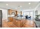 Bright kitchen showcasing an island, stainless appliances, and an adjacent dining area at 2004 Ptarmigan Ct, Waxhaw, NC 28173