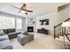 Comfortable living room featuring a fireplace and a cozy sectional sofa at 2004 Ptarmigan Ct, Waxhaw, NC 28173