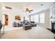 Bright living room with large windows, fireplace, plush seating, and open access to the kitchen at 2004 Ptarmigan Ct, Waxhaw, NC 28173