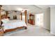 Bright main bedroom featuring a four-poster bed, dresser and an ensuite bathroom at 2004 Ptarmigan Ct, Waxhaw, NC 28173