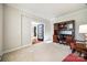 Bright office space featuring a traditional wooden desk set and neutral carpeting at 2004 Ptarmigan Ct, Waxhaw, NC 28173