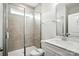 The bathroom features a tiled shower with glass door, vanity with white countertop, and tile flooring at 2017 Embassy Ct # 51, Charlotte, NC 28213