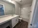 Bathroom featuring a vanity with a sink and a shower-tub combo at 2017 Embassy Ct # 51, Charlotte, NC 28213