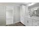 Bright bathroom features a sleek white vanity, quartz countertop, and modern fixtures in new home at 2017 Embassy Ct # 51, Charlotte, NC 28213