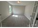 Carpeted bedroom with bright natural light at 2017 Embassy Ct # 51, Charlotte, NC 28213