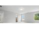 A spacious bedroom with neutral walls, plush carpet, ample natural light and bathroom entrance at 2017 Embassy Ct # 51, Charlotte, NC 28213