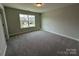 Bright bedroom with neutral walls and plush carpeting at 2017 Embassy Ct # 51, Charlotte, NC 28213
