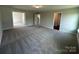 Spacious bedroom featuring neutral paint, carpet, a ceiling light and multiple doorways at 2017 Embassy Ct # 51, Charlotte, NC 28213