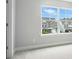 Bedroom with large window allowing ample natural light; view to neighborhood at 2017 Embassy Ct # 51, Charlotte, NC 28213
