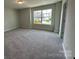 Bedroom with plush carpeting and bright, natural light at 2017 Embassy Ct # 51, Charlotte, NC 28213